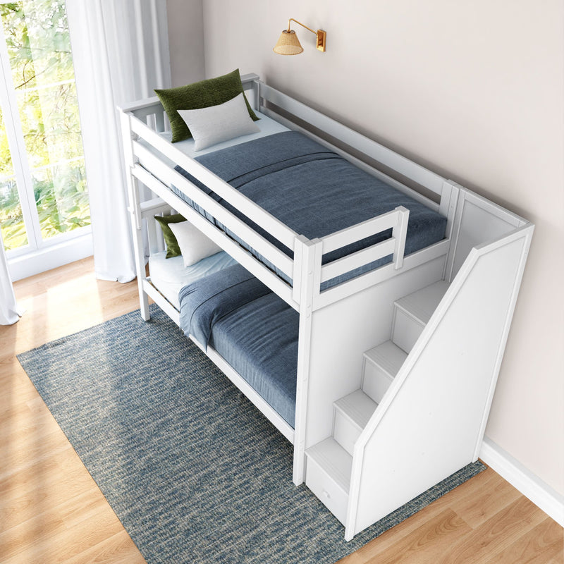 White wooden bunk bed with stairs, featuring blue bedding and green accent pillows in a bright modern bedroom.