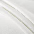 Soft white textured fabric with close-up detail.