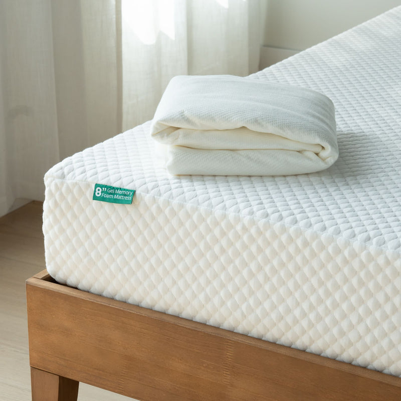 8-inch gel memory foam mattress on wooden bed frame with folded white cover.