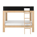 Twin-over-full wooden bunk bed with ladder, natural oak finish frame, black upper guardrail and white mattresses — modern kids loft bed