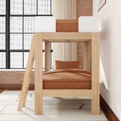 Modern natural wood loft bunk bed with rust-orange bedding in industrial loft bedroom with exposed brick wall, large grid windows and neutral rug
