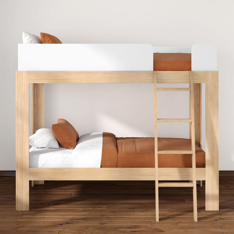 Modern natural wood twin-over-twin bunk bed with ladder, white and rust-orange bedding in a minimalist kids' bedroom on hardwood floor
