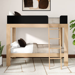 Modern natural wood twin-over-twin bunk bed with ladder and black guardrail, neutral bedding and minimalist bedroom decor