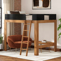 Modern wooden loft bed with ladder and black safety rails over cozy reading nook featuring a rust-colored armchair, round coffee table, exposed brick accent wall and indoor plant