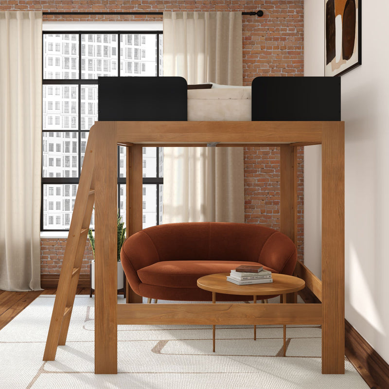 Modern wooden loft bed over rust-orange loveseat and round coffee table in bright loft apartment with exposed brick wall and large industrial window