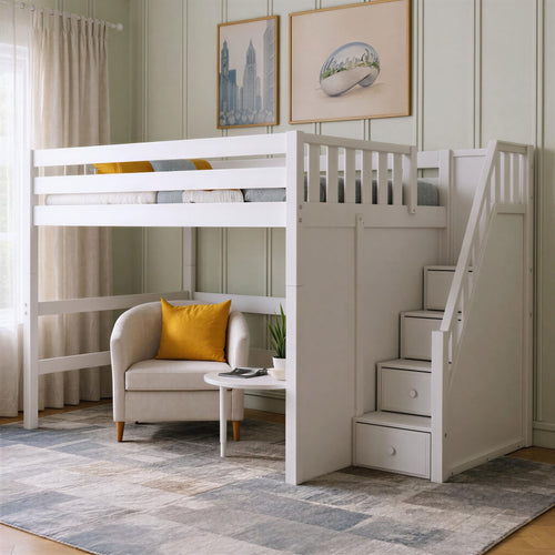 White loft bed with built-in drawer stairs in a small-space modern bedroom, featuring a cozy beige armchair with mustard pillow, round side table, potted plant, patterned rug and framed wall art