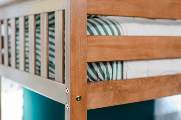 Wooden bunk bed with striped bedding.