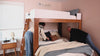 Adults relaxing and hanging out around their bunk beds for adults.