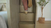 Different scenes of adults climbing the stairs of a bunk, a woman sleeping on a top bunk, and groups of adults sitting on the bottom of a large wooden bunk bed talking.